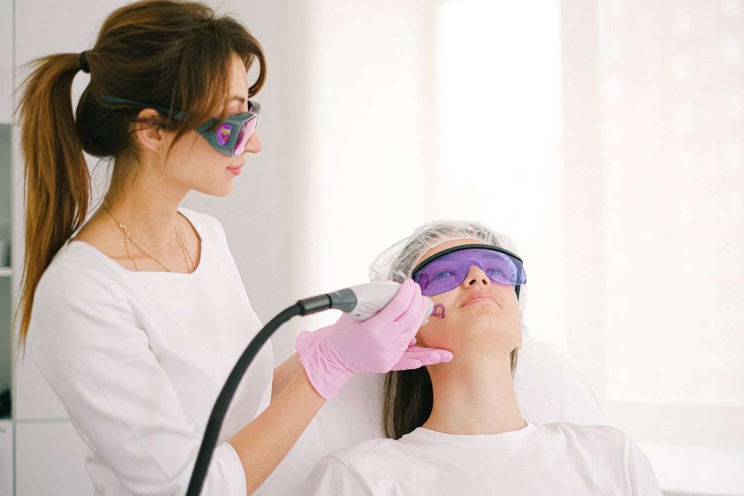 Laser hair reduction sessions in progress at a dermatology clinic